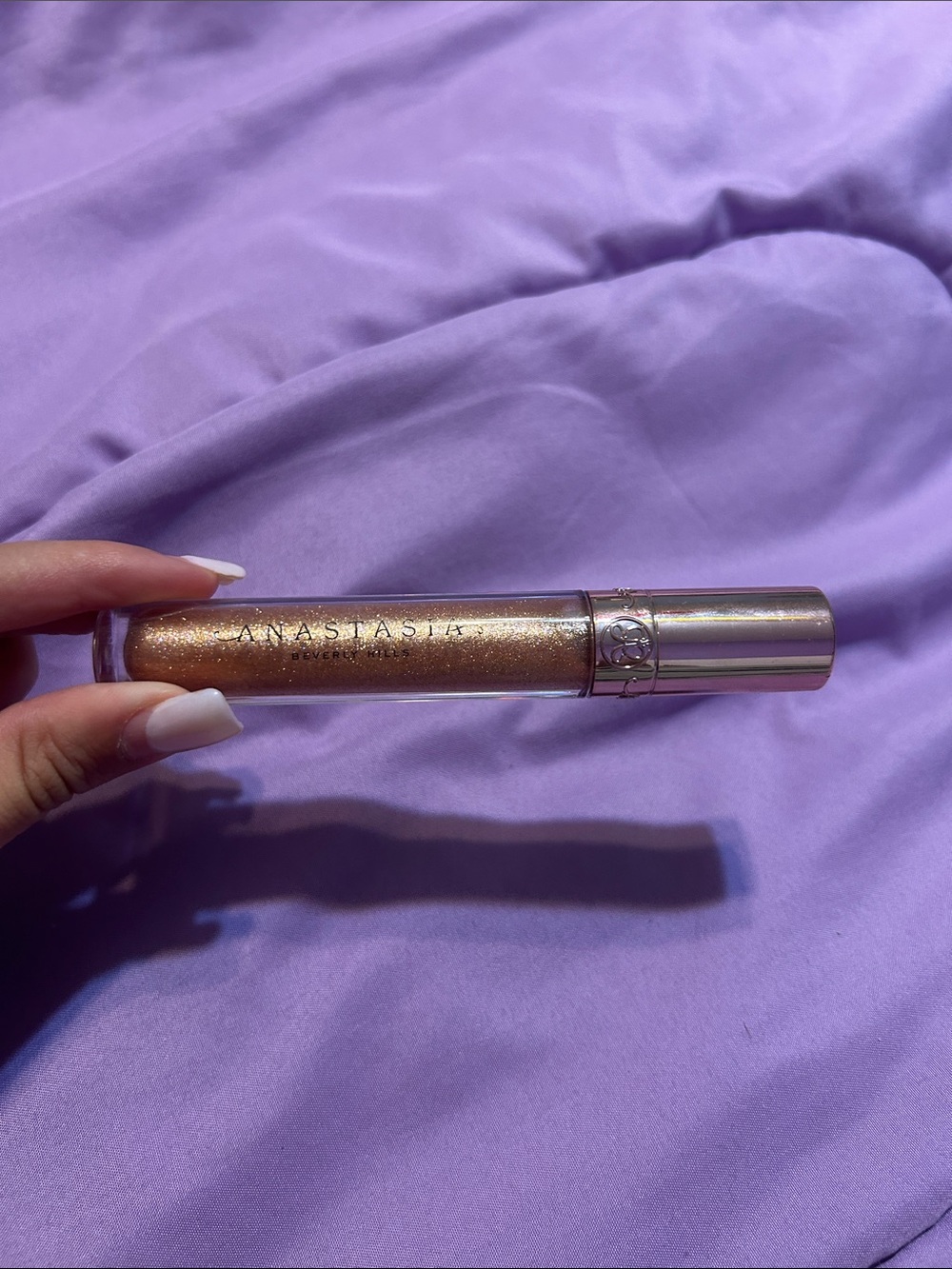 Anastasia Beverly Hills Glitter Lip Gloss in Shimmery Gold-Bronze